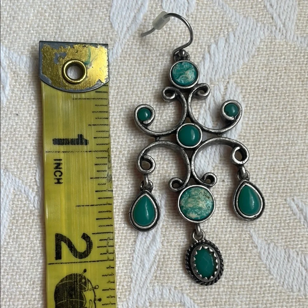 Silver and Green Dangle Earrings with Intricate Design